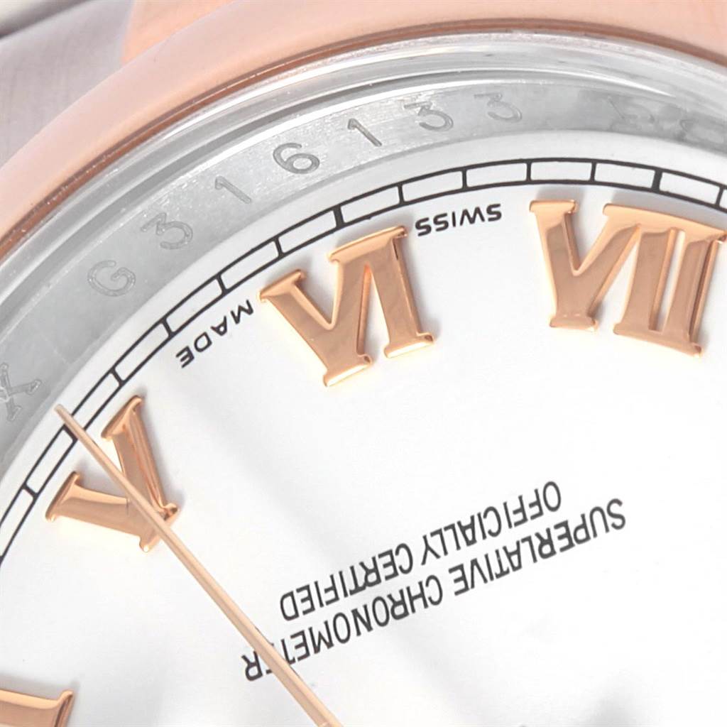 This image shows a close-up of the dial and case of a Rolex Datejust 116201 Men's Steel and Gold (two tone) White Dial 116201 Men's Steel and Gold (two tone) White Dial, highlighting the Roman numerals and text.