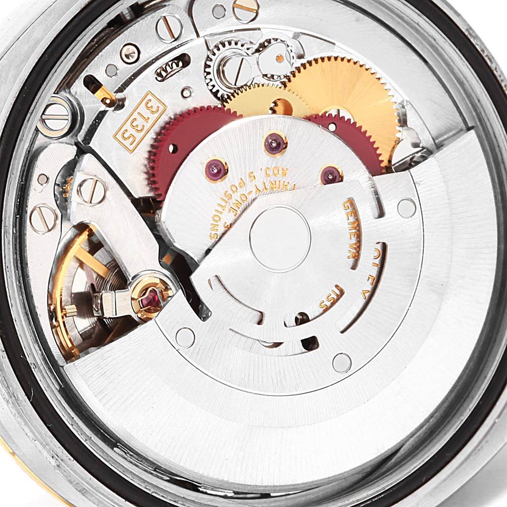 The image shows the inner mechanical movement and components of a Rolex Datejust 116233 Men's Stainless Steel Champagne Dial 116233 Men's Stainless Steel Champagne Dial watch from a close-up, back angle.