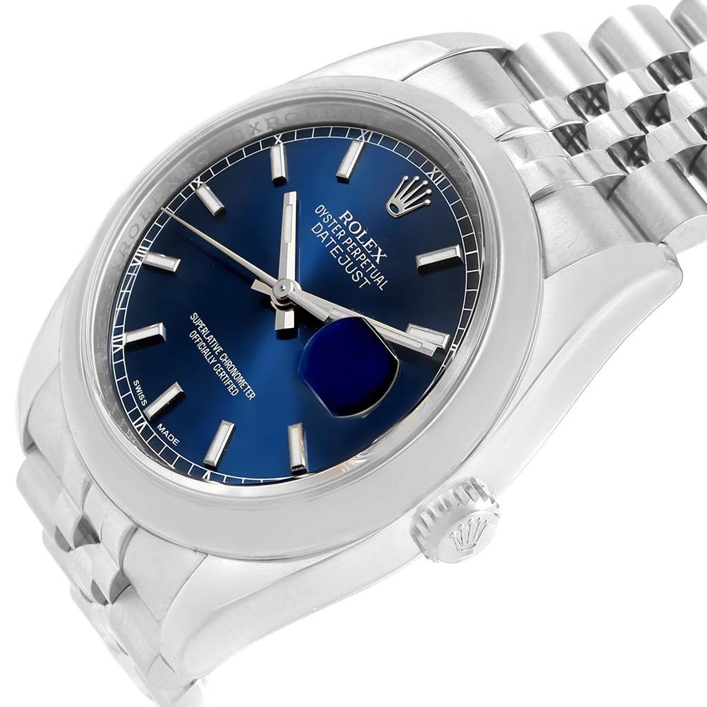 This image shows a Rolex Datejust 116200 Men's Stainless Steel Blue Dial 116200 Men's Stainless Steel Blue Dial watch at an angled view, highlighting its blue dial, crown, and stainless steel bracelet.