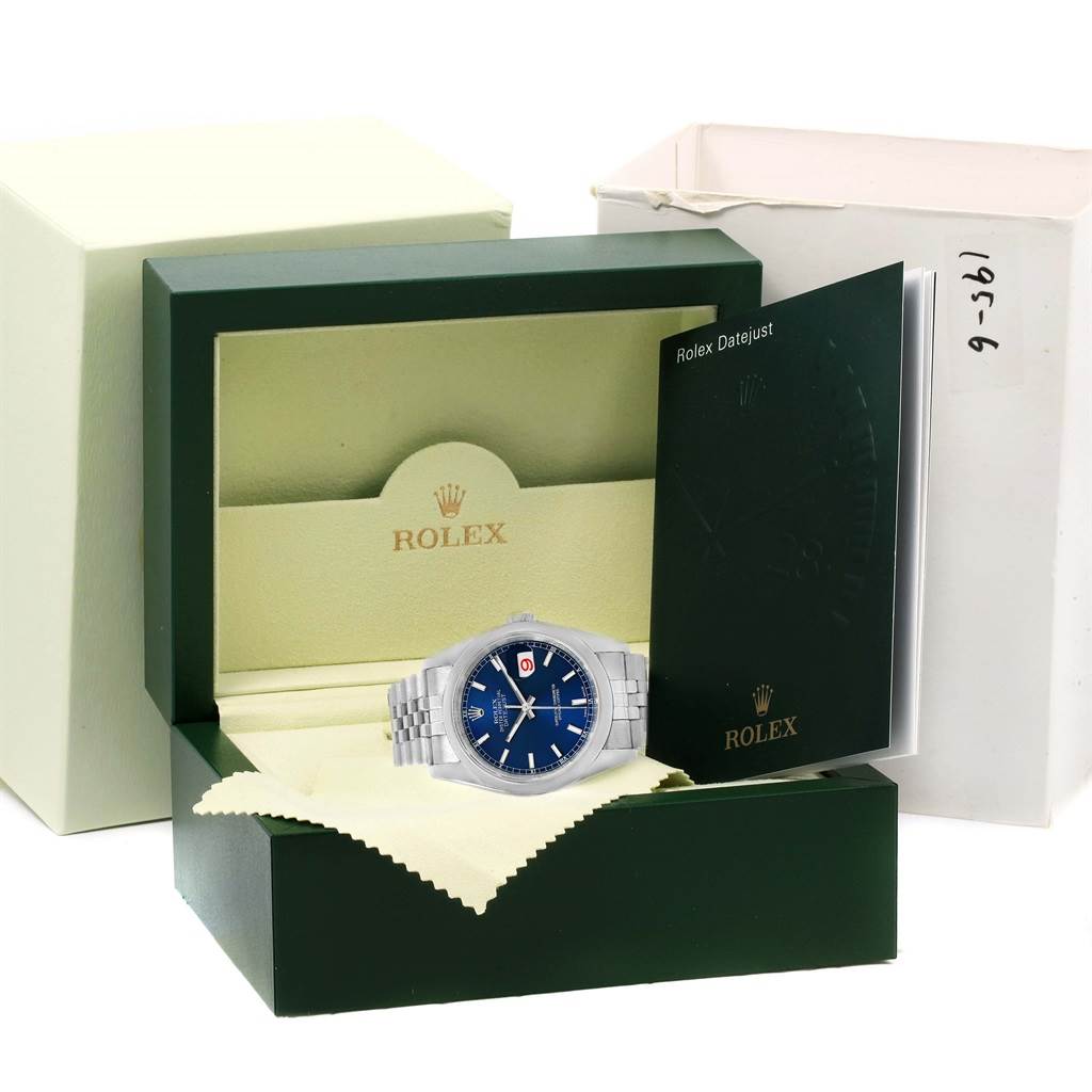 The image shows a Rolex Datejust 116200 Men's Stainless Steel Blue Dial 116200 Men's Stainless Steel Blue Dial watch with a blue dial in its original packaging along with booklets.