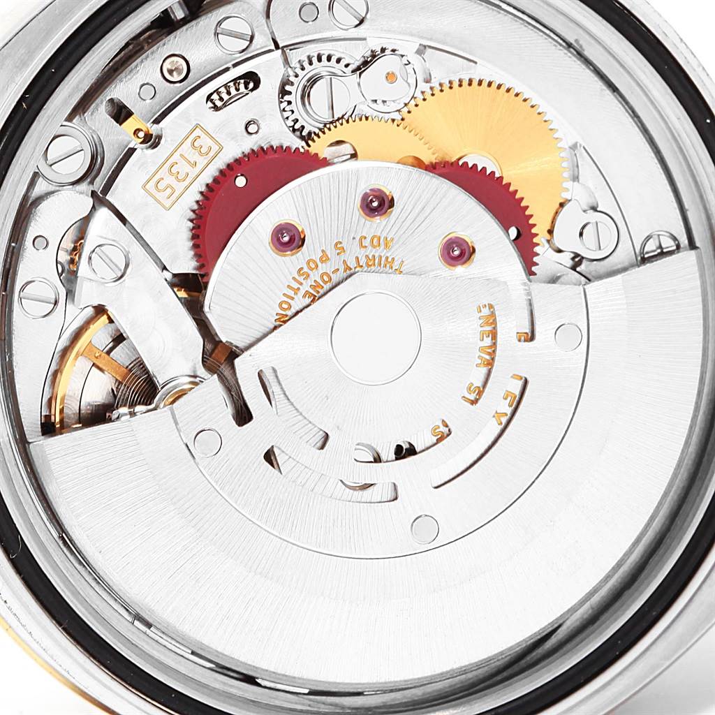 This image shows the inner mechanical movement of the Rolex Datejust 116233 Men's Stainless Steel Blue Dial 116233 Men's Stainless Steel Blue Dial watch at a close-up angle.