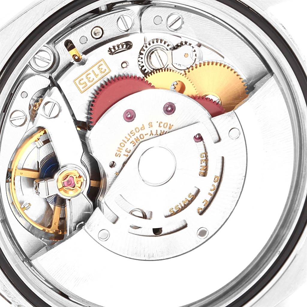 This image shows the inner mechanical movement of the Rolex Datejust 116200 Men's Stainless Steel Black Dial 116200 Men's Stainless Steel Black Dial watch from a close-up angle, highlighting its gears and components.