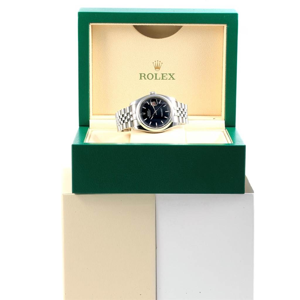 The image shows a Rolex Datejust 116200 Men's Stainless Steel Black Dial 116200 Men's Stainless Steel Black Dial watch placed front-facing in an open green Rolex box.