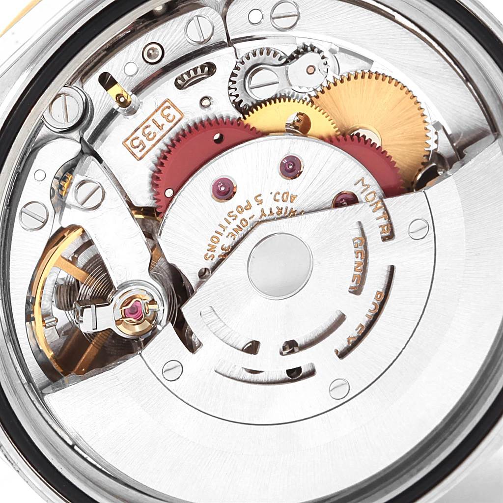 The image shows an internal view of the Rolex Datejust 16233 Men's Steel and Gold (two tone) Champagne Dial 16233 Men's Steel and Gold (two tone) Champagne Dial watch's movement and gears.