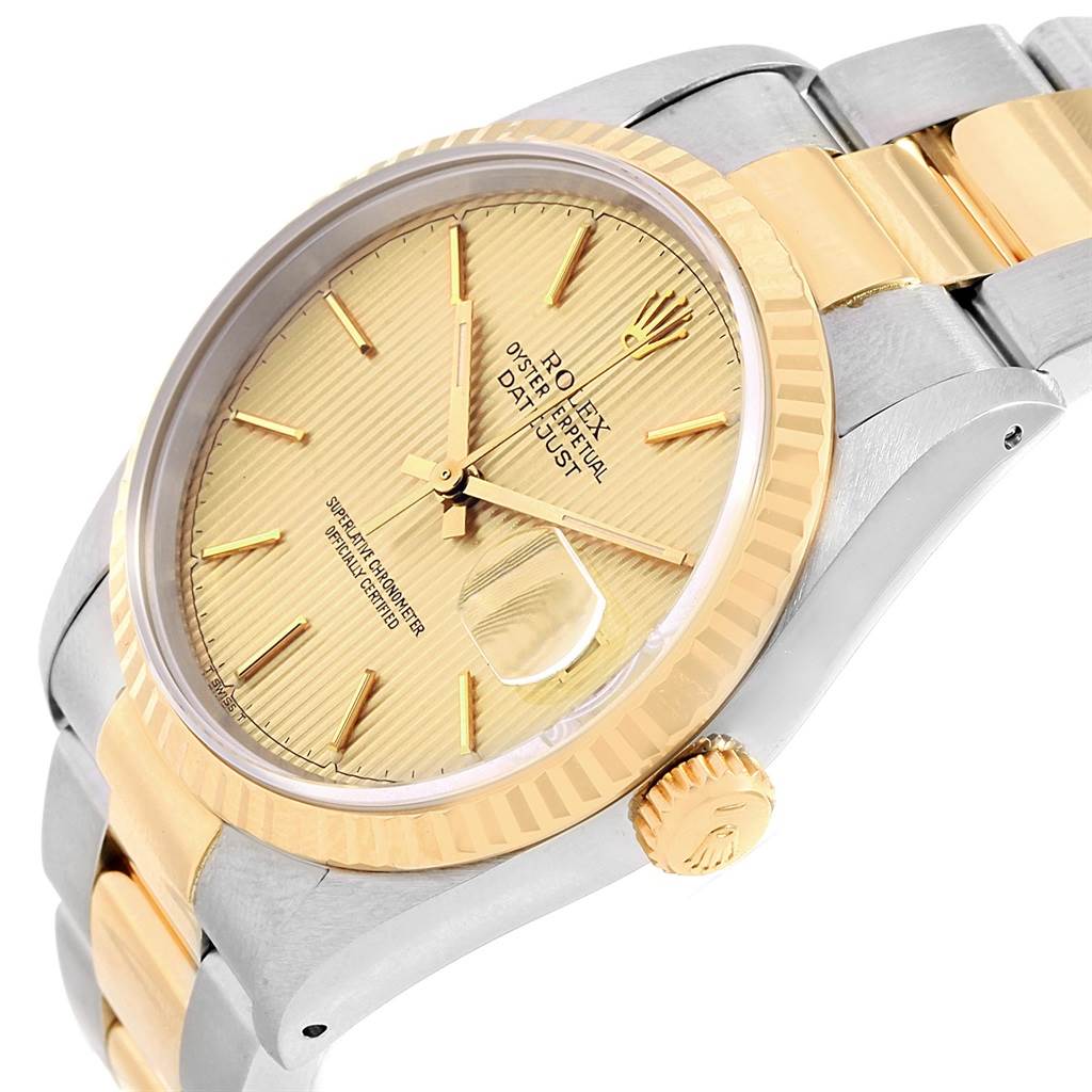 The image shows a close-up angled view of the Rolex Datejust 16233 Men's Steel and Gold (two tone) Champagne Dial 16233 Men's Steel and Gold (two tone) Champagne Dial watch, highlighting its gold dial, bezel, crown, and part of the bracelet.