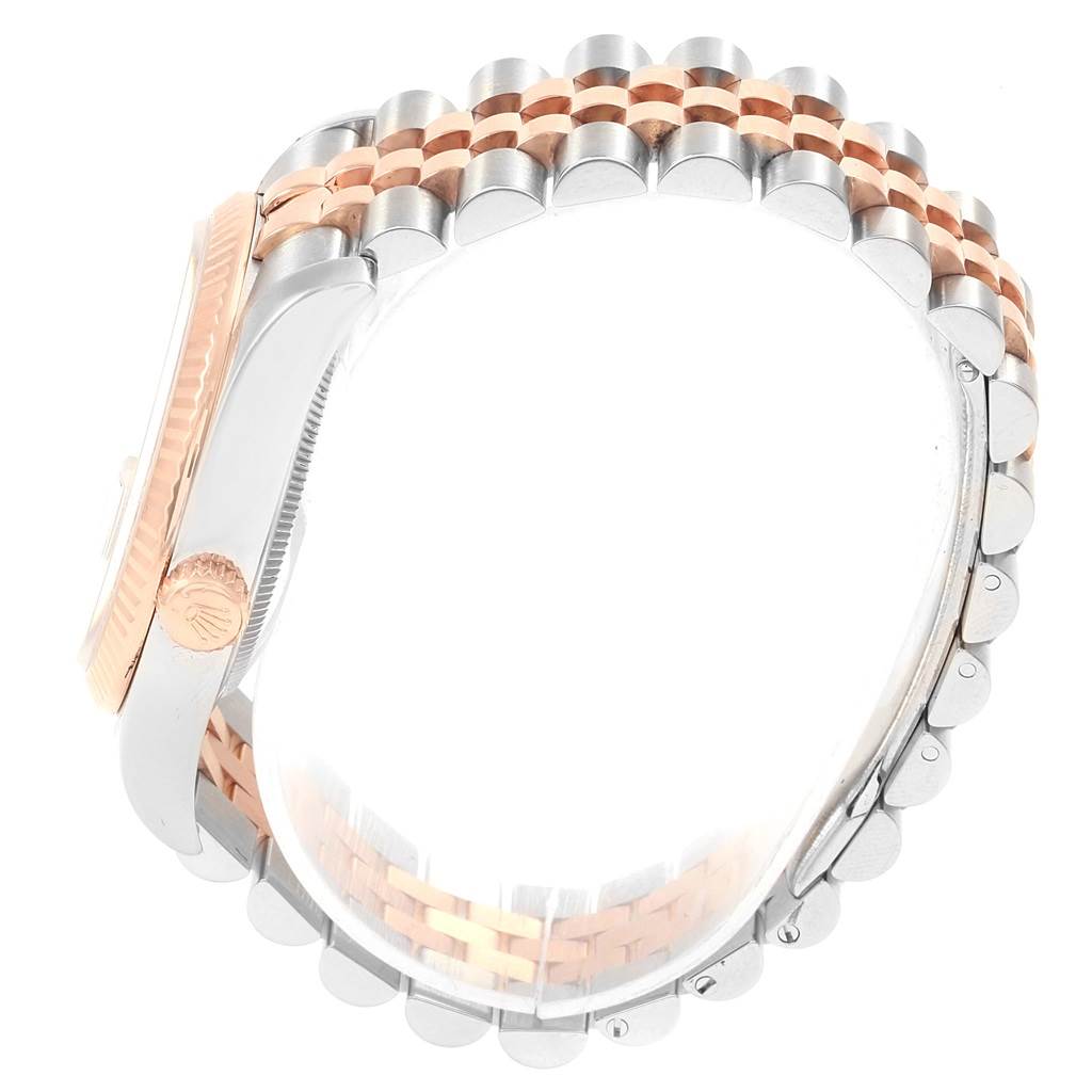 This is a side view of the Rolex Datejust 116231 Men's Steel and Gold (two tone) Grey Dial 116231 Men's Steel and Gold (two tone) Grey Dial watch, showing the case, crown, and Jubilee bracelet.