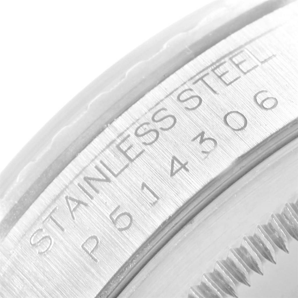 The image shows a close-up view of the serial number and "Stainless Steel" engraving on the Rolex Datejust 16220 Men
s Stainless Steel White Dial 16220 Men
s Stainless Steel White Dial model.