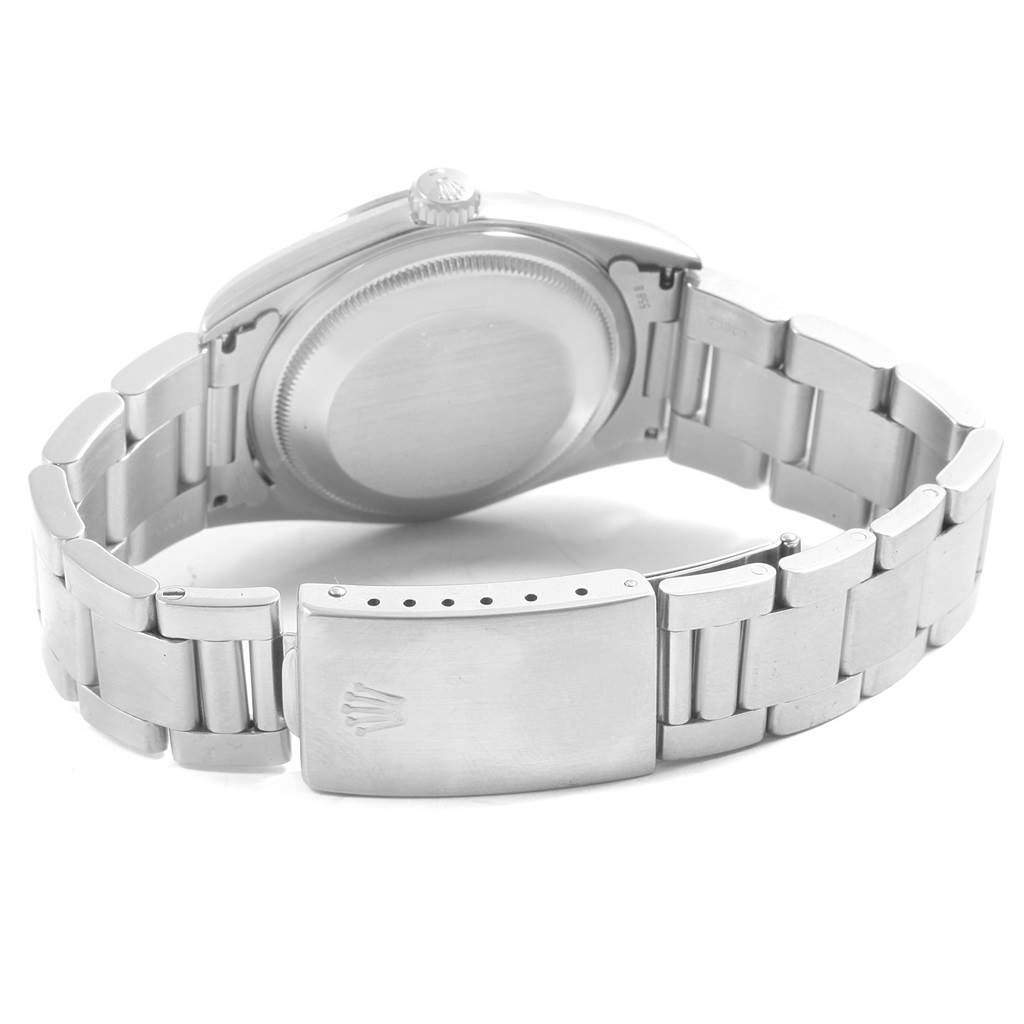 The image shows the back view of a Rolex Datejust 16200 Men's Stainless Steel Black Dial 16200 Men's Stainless Steel Black Dial watch, highlighting its stainless steel case and bracelet.