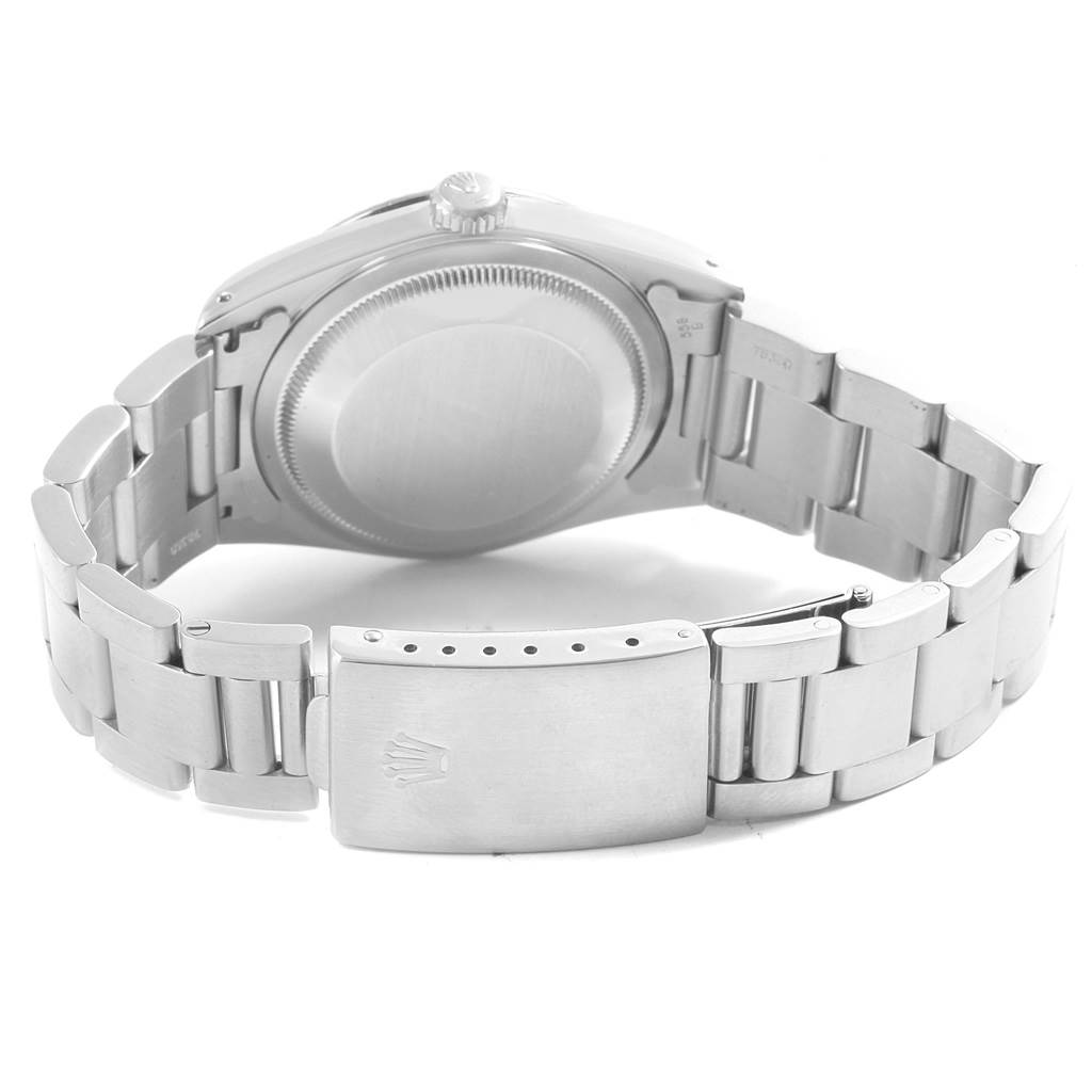 The image shows the back view of a Rolex Datejust 16220 Men's Stainless Steel Black Dial 16220 Men's Stainless Steel Black Dial watch, featuring the case back, crown, and stainless steel bracelet with the clasp.