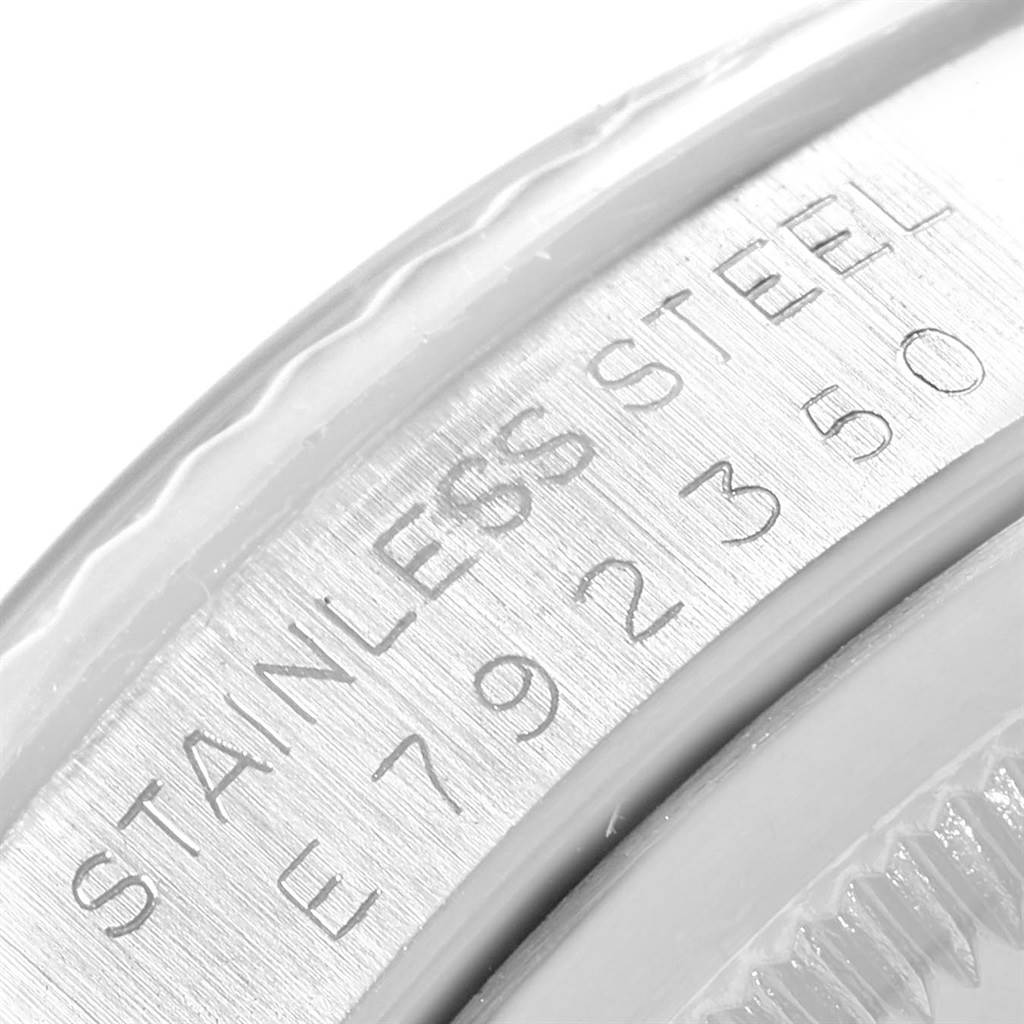 This image shows an extreme close-up angle of the Datejust model by Rolex, specifically highlighting the stainless steel engraving.