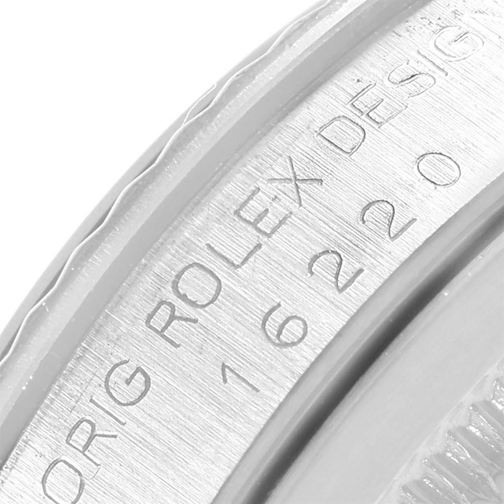 This close-up image shows the engraved inner bezel or rehaut of a Rolex Datejust 16220 Men's Stainless Steel Black Dial 16220 Men's Stainless Steel Black Dial watch.