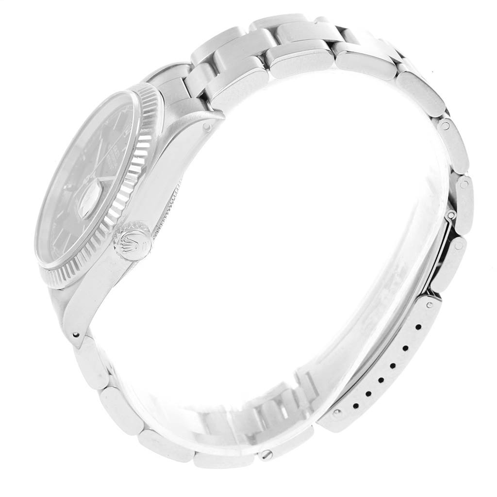 The image shows a side view of the Rolex Datejust 16220 Men's Stainless Steel Black Dial 16220 Men's Stainless Steel Black Dial watch, highlighting the bracelet, crown, and part of the dial.