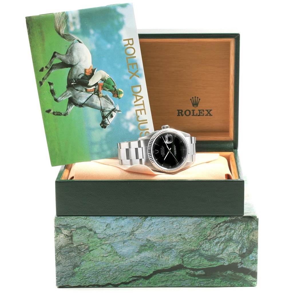 The image shows a Rolex Datejust 16220 Men's Stainless Steel Black Dial 16220 Men's Stainless Steel Black Dial watch in its open box, accompanied by a booklet.