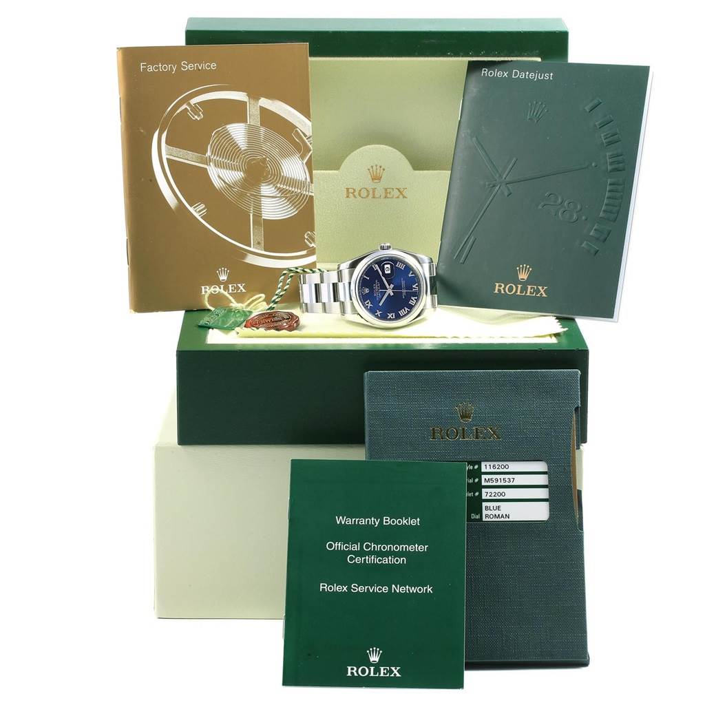 This image shows a Rolex Datejust 116200 Men's Stainless Steel Blue Dial 116200 Men's Stainless Steel Blue Dial watch, manuals, certifications, and packaging, including the factory service and warranty booklets.