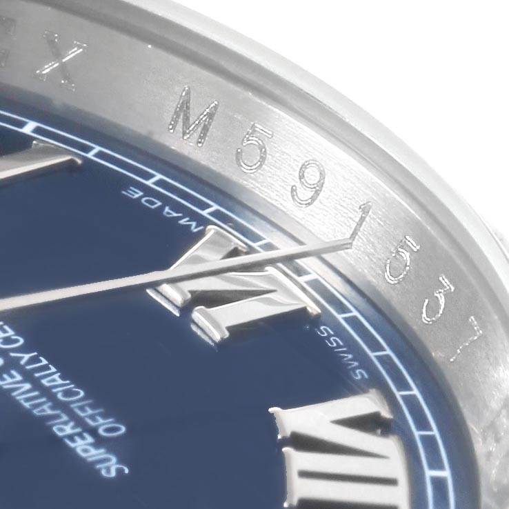 This close-up angle shows the Roman numeral hour markers and part of the dial of a Rolex Datejust 116200 Men's Stainless Steel Blue Dial 116200 Men's Stainless Steel Blue Dial.