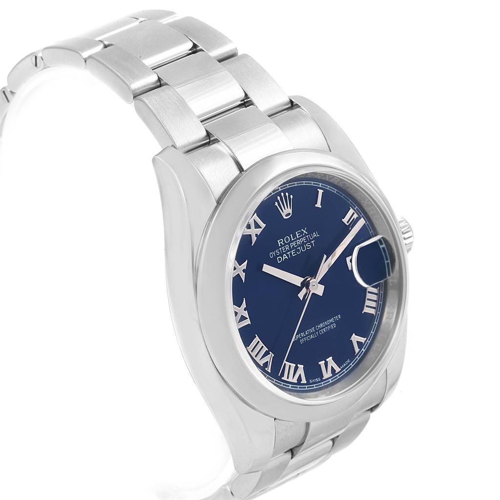 The image shows a side angle of a Rolex Datejust 116200 Men's Stainless Steel Blue Dial 116200 Men's Stainless Steel Blue Dial watch, featuring its blue dial, Roman numerals, and stainless steel bracelet.