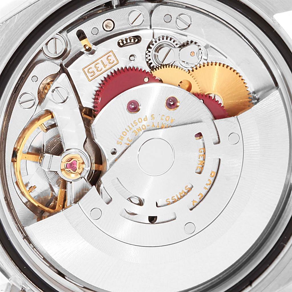 This close-up image shows the internal mechanical movement of a Rolex Datejust 116200 Men's Stainless Steel Blue Dial 116200 Men's Stainless Steel Blue Dial watch.
