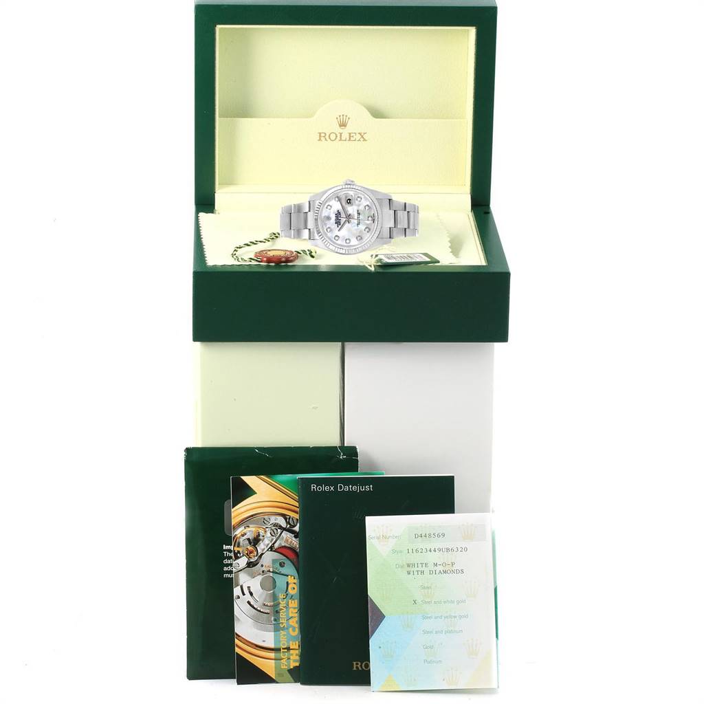 The Rolex Datejust 116234 Men's Stainless Steel Mother of Pearl Dial 116234 Men's Stainless Steel Mother of Pearl Dial watch is shown in its box at a front angle, along with various documentation and accessories.