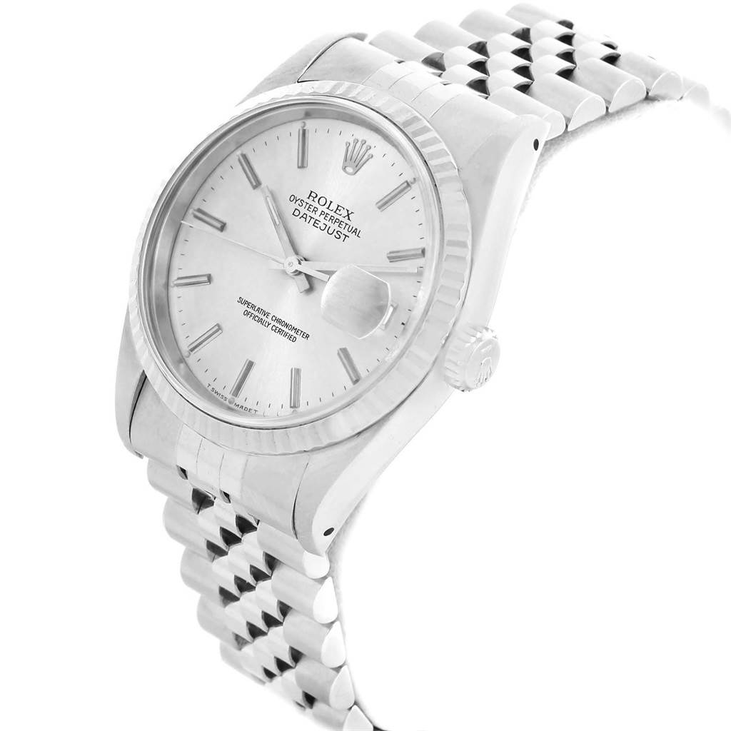 The image shows a side angle view of a Rolex Datejust 16234 Men's Stainless Steel Silver Dial 16234 Men's Stainless Steel Silver Dial, highlighting its dial, fluted bezel, crown, and metal bracelet.