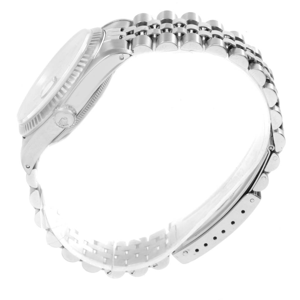 The Rolex Datejust 16234 Men's Stainless Steel Silver Dial 16234 Men's Stainless Steel Silver Dial model watch is shown at a side angle, highlighting its bracelet, case, and crown.