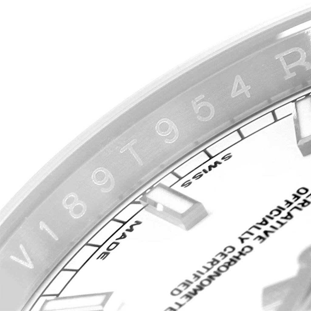 The image focuses on the rehaut, chapter ring, and part of the dial of a Rolex Datejust 116200 Men's Stainless Steel White Dial 116200 Men's Stainless Steel White Dial watch, showing the serial number.