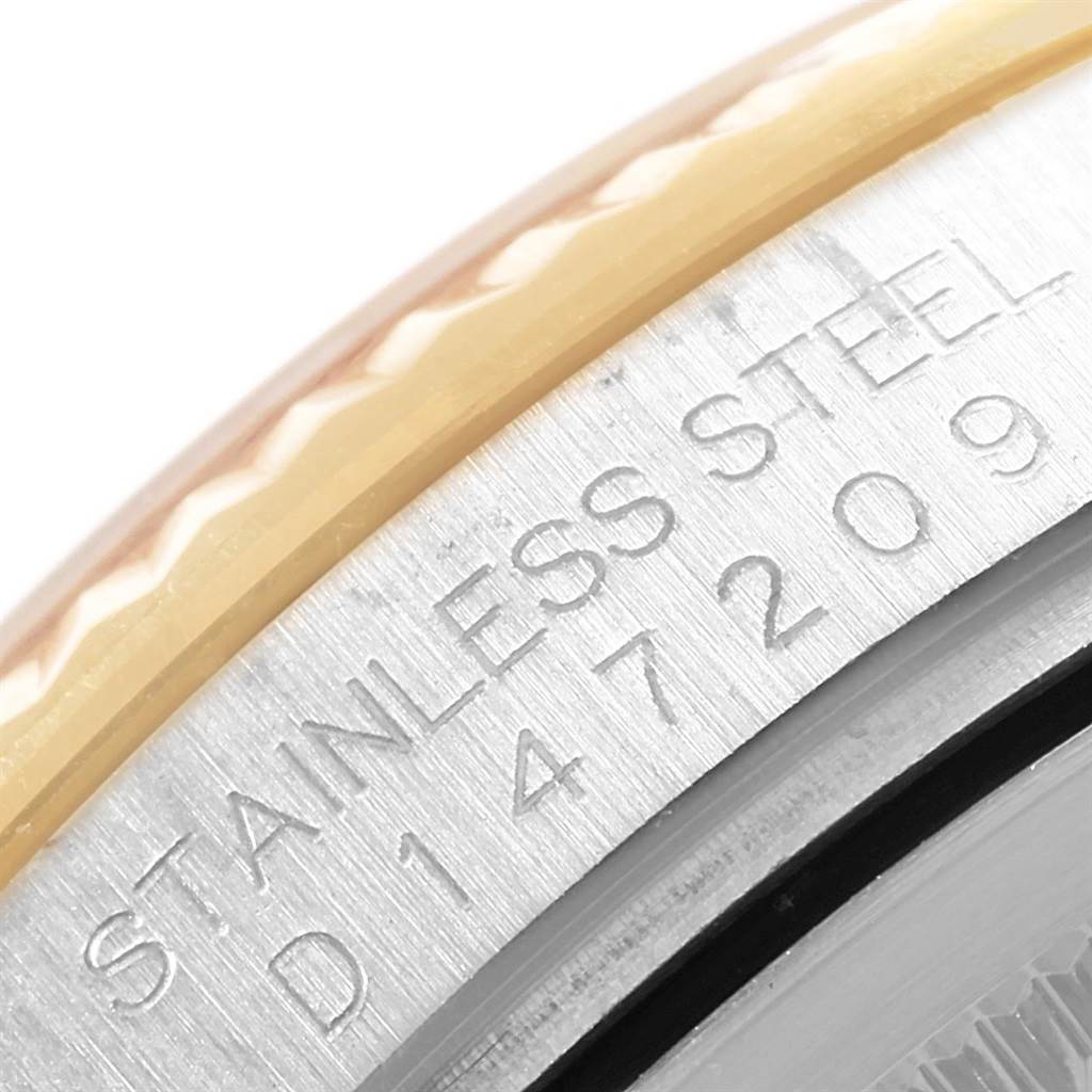 This close-up image of a Rolex Datejust 116233 Men's Stainless Steel Champagne Dial 116233 Men's Stainless Steel Champagne Dial watch shows the side view with the stainless steel and model number engraving.