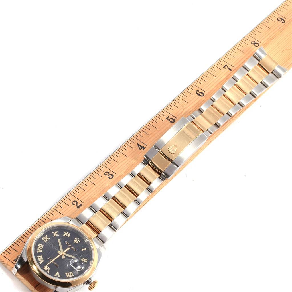 The image shows the front view of the Rolex Datejust 116203 Men's Stainless Steel Black Dial 116203 Men's Stainless Steel Black Dial watch laid alongside a ruler, highlighting the dial, bezel, and bracelet.