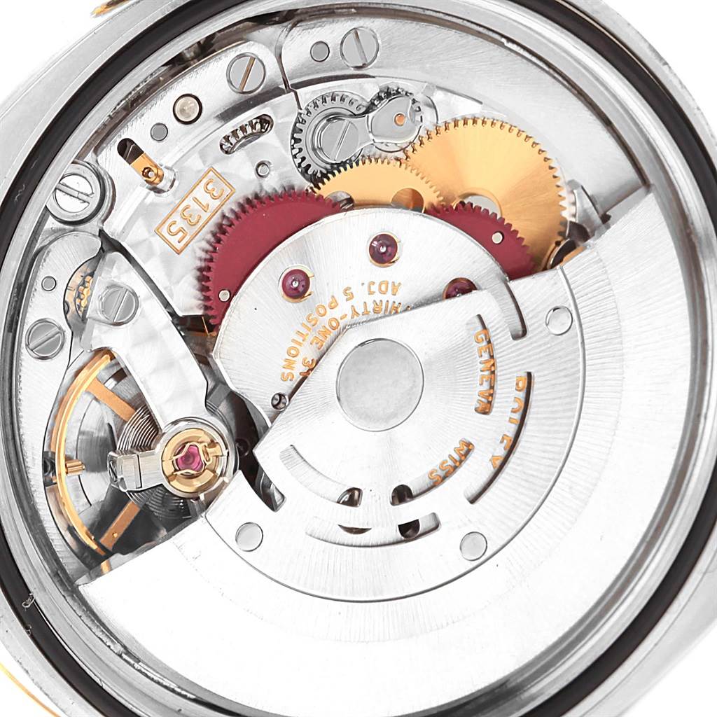 This close-up image shows the intricate internal movement of the Rolex Datejust 116203 Men's Stainless Steel Black Dial 116203 Men's Stainless Steel Black Dial watch.