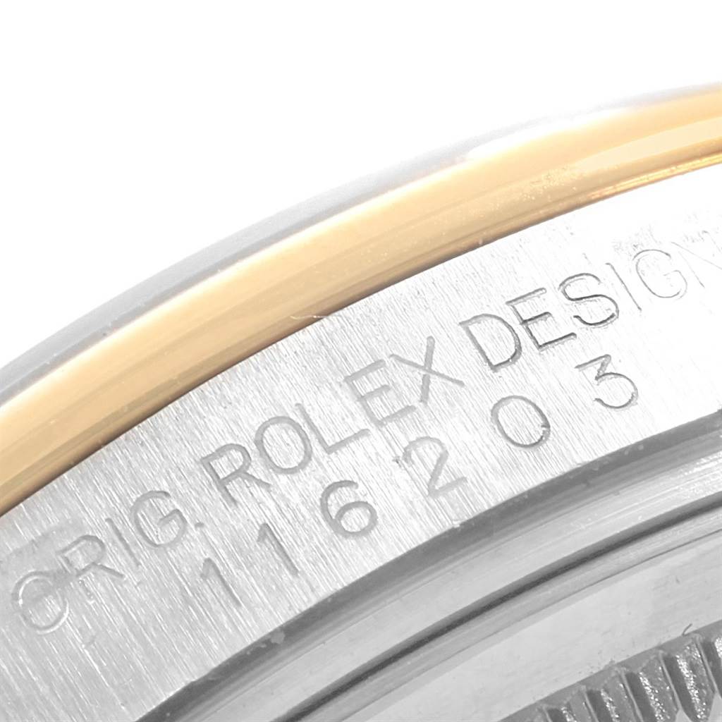The image shows the engraved reference number and bezel edge of a Rolex Datejust 116203 Men's Stainless Steel Black Dial 116203 Men's Stainless Steel Black Dial watch.
