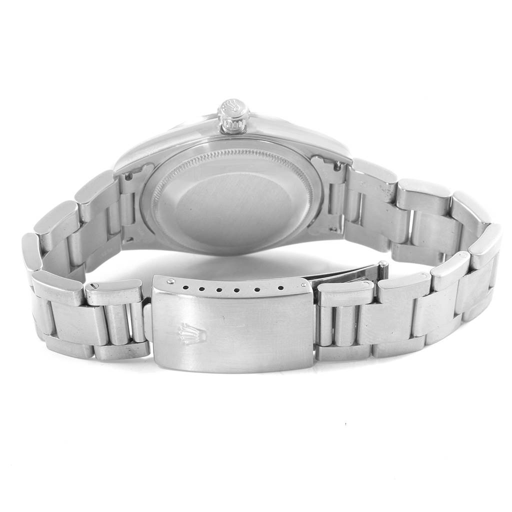 This image shows the back of the Rolex Datejust 16220 Men's Stainless Steel White Dial 16220 Men's Stainless Steel White Dial watch, featuring the case back, crown, and metal bracelet with the clasp open.