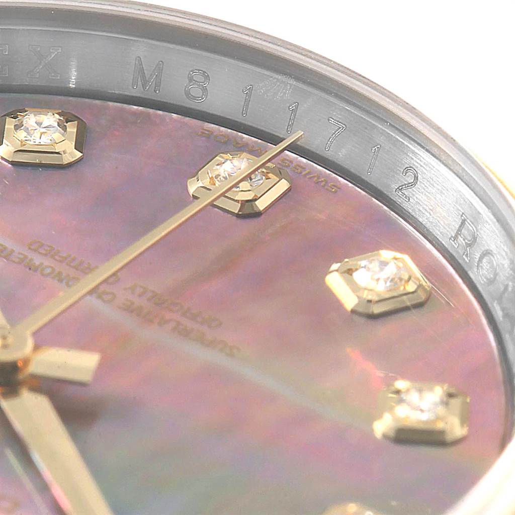 This close-up view of the Rolex Datejust 116203 Men's Stainless Steel Mother of Pearl Dial 116203 Men's Stainless Steel Mother of Pearl Dial watch shows the diamond-set dial and part of the rehaut with engraved numbers.