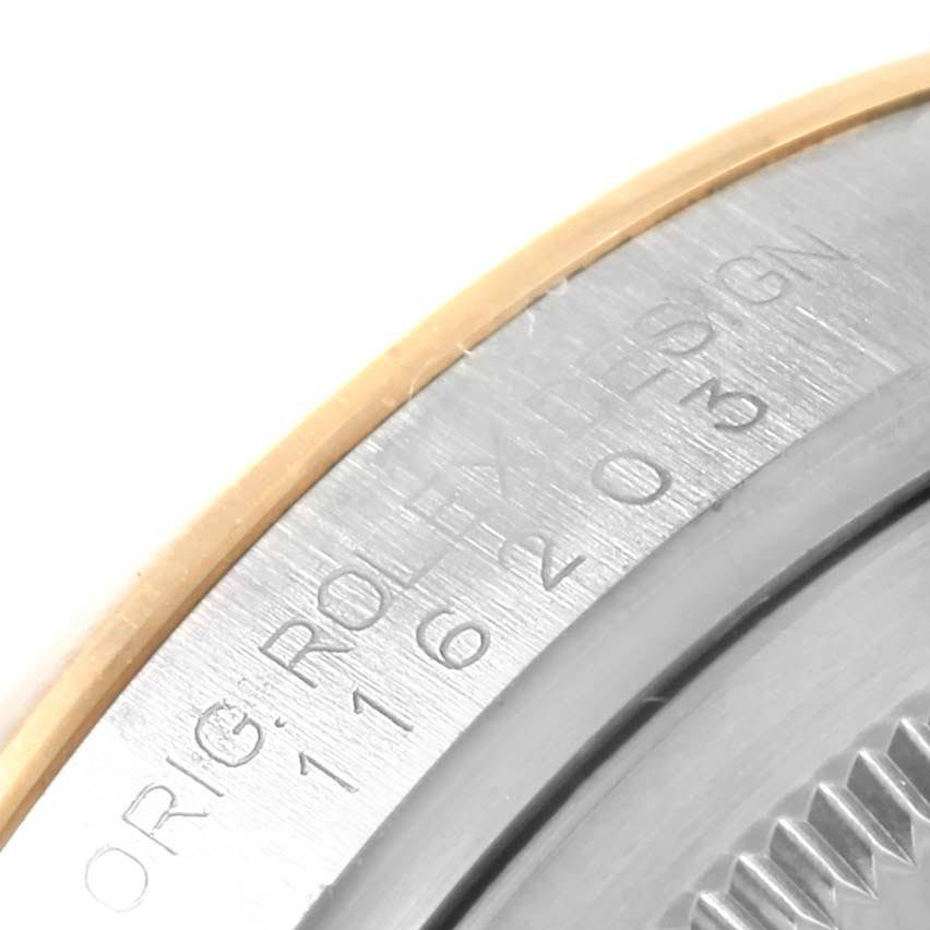 This is a close-up of the bezel and inner case of a Rolex Datejust 116203 Men's Steel and Gold (two tone) Silver Dial 116203 Men's Steel and Gold (two tone) Silver Dial watch, showing engraved details.