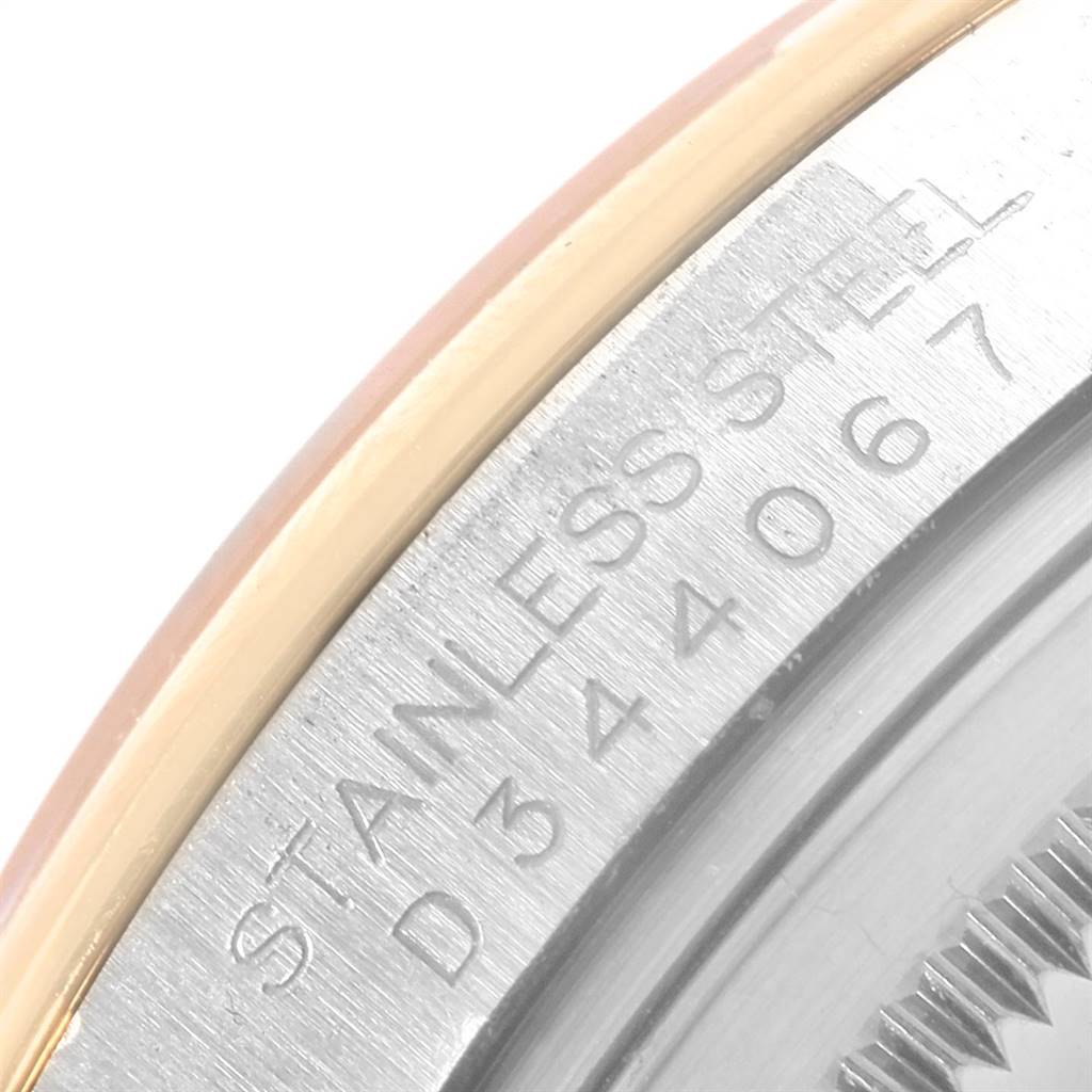 This image shows a close-up of the serial number and bezel edge of a Rolex Datejust 116203 Men's Steel and Gold (two tone) Silver Dial 116203 Men's Steel and Gold (two tone) Silver Dial watch.
