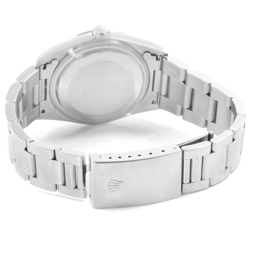 The image shows the backside of a Rolex Datejust 16200 Men's Stainless Steel Silver Dial 16200 Men's Stainless Steel Silver Dial watch, highlighting the case back, bracelet, and clasp with the Rolex logo.