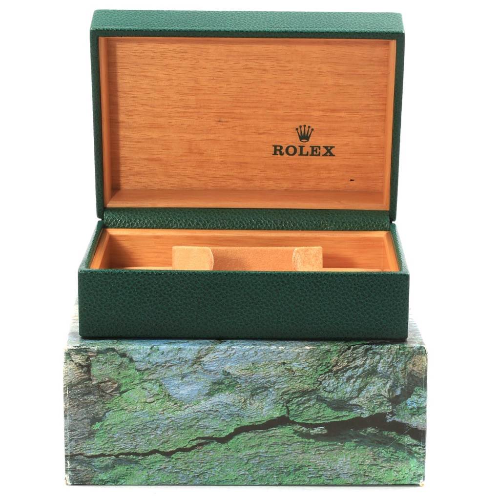 The image shows an open Rolex Datejust 16200 Men's Stainless Steel Silver Dial 16200 Men's Stainless Steel Silver Dial watch box with green exterior and wooden interior, displaying the Rolex logo.