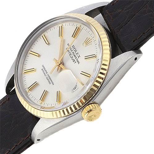 The image shows a Rolex Datejust 16013 Men's Steel and Gold (two tone) Silver Dial 16013 Men's Steel and Gold (two tone) Silver Dial watch at an oblique angle highlighting its gold fluted bezel, white dial, and leather strap.