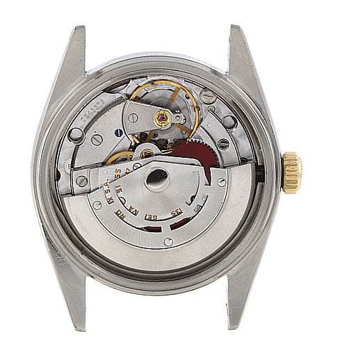 The image shows the back view of a Rolex Datejust 16013 Men's Steel and Gold (two tone) Silver Dial 16013 Men's Steel and Gold (two tone) Silver Dial watch, highlighting its internal mechanical movement and components.