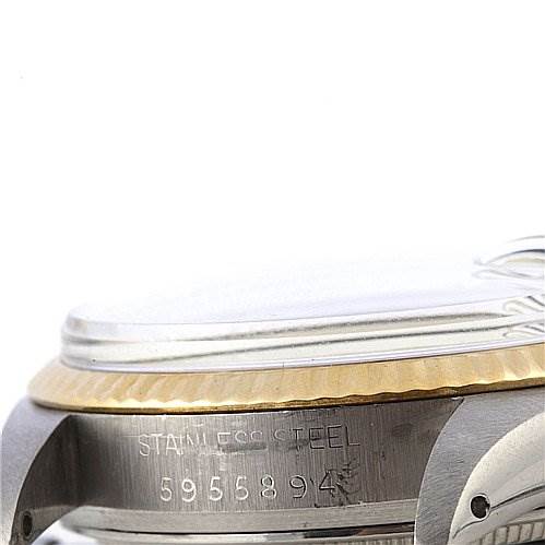 This image shows a close-up side view of the case and bezel of a Rolex Datejust 16013 Men's Steel and Gold (two tone) Silver Dial 16013 Men's Steel and Gold (two tone) Silver Dial watch, highlighting the serial number and stainless steel component.