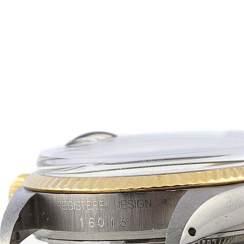 The image shows a side view of the Rolex Datejust 16013 Men's Steel and Gold (two tone) Silver Dial 16013 Men's Steel and Gold (two tone) Silver Dial watch, highlighting the bezel, crown, and the "REGISTERED DESIGN 16013" engraving.
