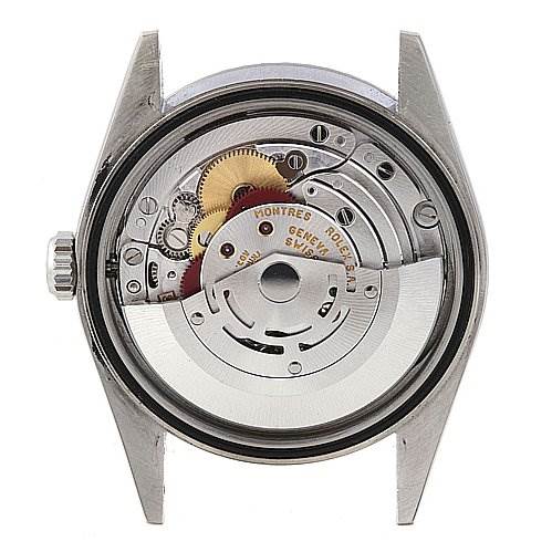 The image shows the back view of a Rolex Datejust 16220 Men's Stainless Steel Silver Dial 16220 Men's Stainless Steel Silver Dial model, revealing its internal mechanical movement components.
