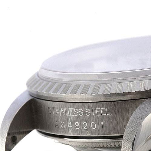 The image shows a side view of a Rolex Datejust 16220 Men's Stainless Steel Silver Dial 16220 Men's Stainless Steel Silver Dial watch, focusing on the case, bezel, and part of the crystal.