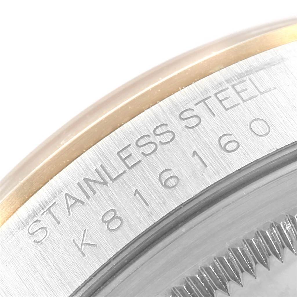 This image shows a close-up of the stainless steel case back and serial number of a Rolex Datejust 16203 Men's Steel and Gold (two tone) Silver Dial 16203 Men's Steel and Gold (two tone) Silver Dial watch.