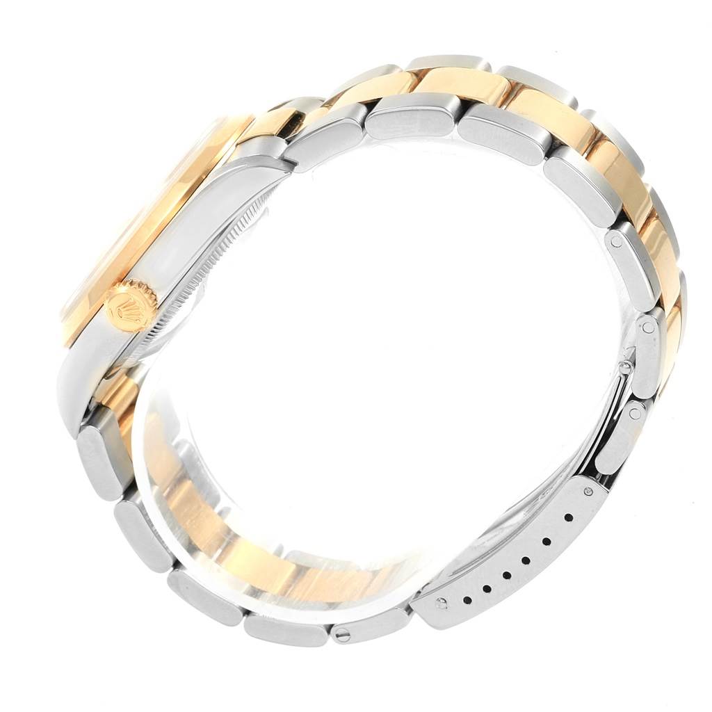 The image shows the side profile of a Rolex Datejust 16203 Men's Steel and Gold (two tone) Silver Dial 16203 Men's Steel and Gold (two tone) Silver Dial watch, emphasizing the crown, case, and two-tone bracelet.