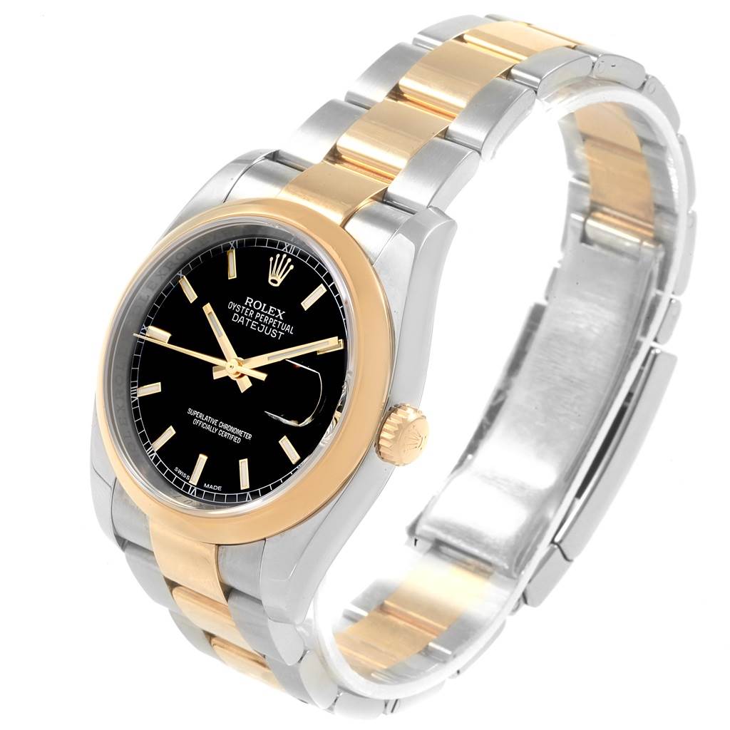 The image shows a tilt-angle view of a Rolex Datejust 116203 Men's Stainless Steel Black Dial 116203 Men's Stainless Steel Black Dial with a black dial, gold bezel, and two-tone bracelet.