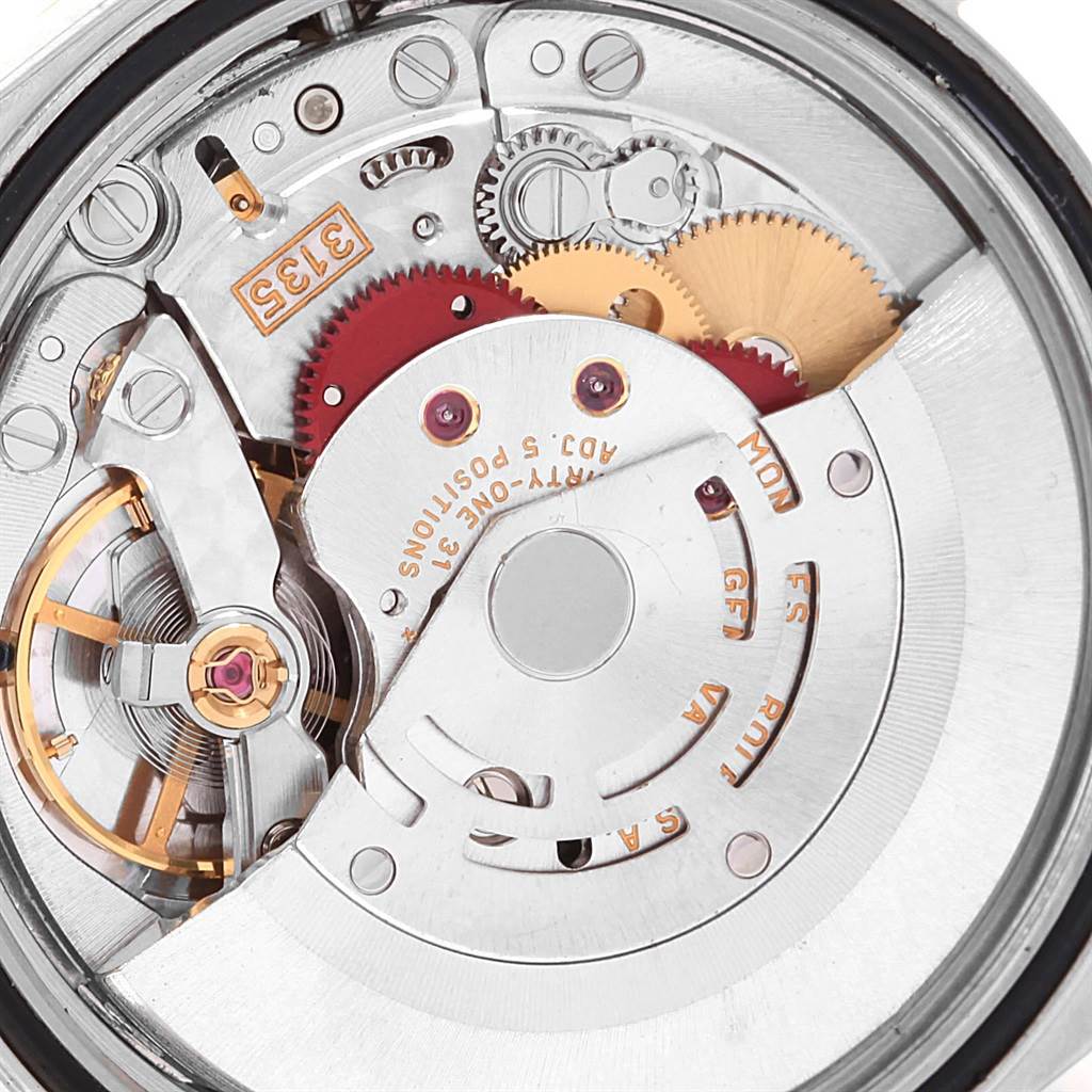 This image shows a close-up of the movement parts inside a Rolex Datejust 16233 Men's Steel and Gold (two tone) Champagne Dial 16233 Men's Steel and Gold (two tone) Champagne Dial watch.