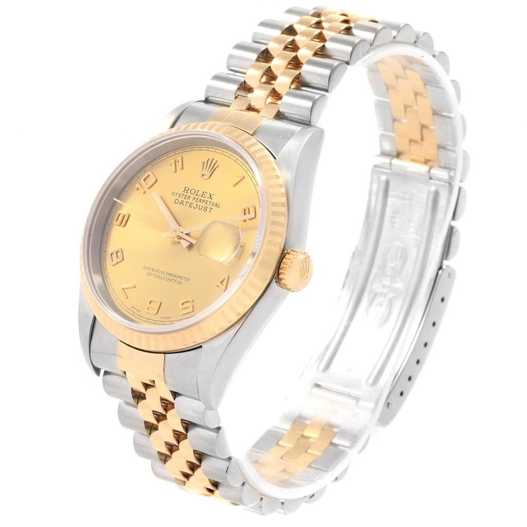 This Rolex Datejust 16233 Men's Steel and Gold (two tone) Champagne Dial 16233 Men's Steel and Gold (two tone) Champagne Dial watch is shown at an angled view highlighting its gold and silver bracelet, fluted bezel, and champagne dial.