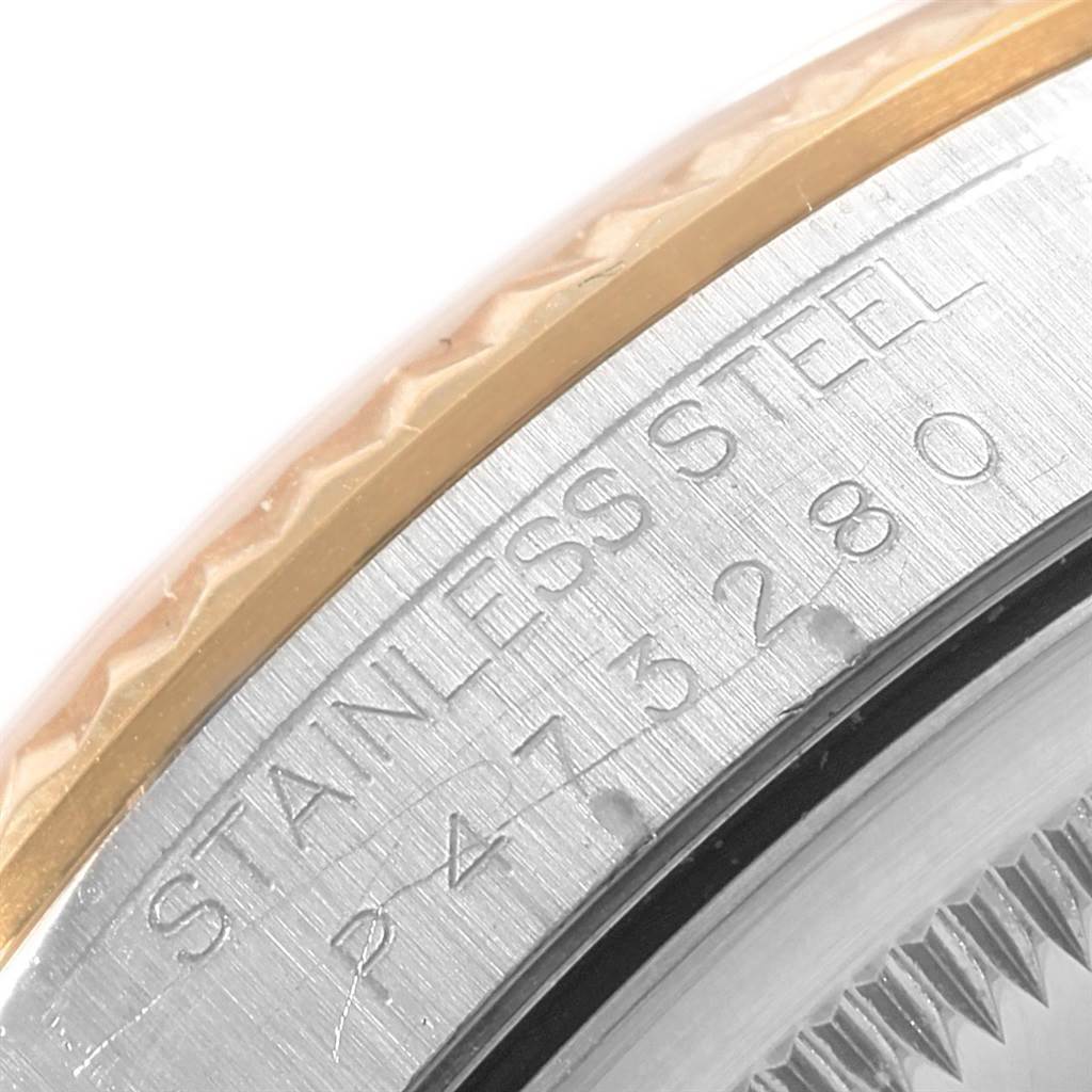This image shows a close-up of the side engraving on a Rolex Datejust 16233 Men's Steel and Gold (two tone) Champagne Dial 16233 Men's Steel and Gold (two tone) Champagne Dial watch, highlighting the stainless steel and model number details.