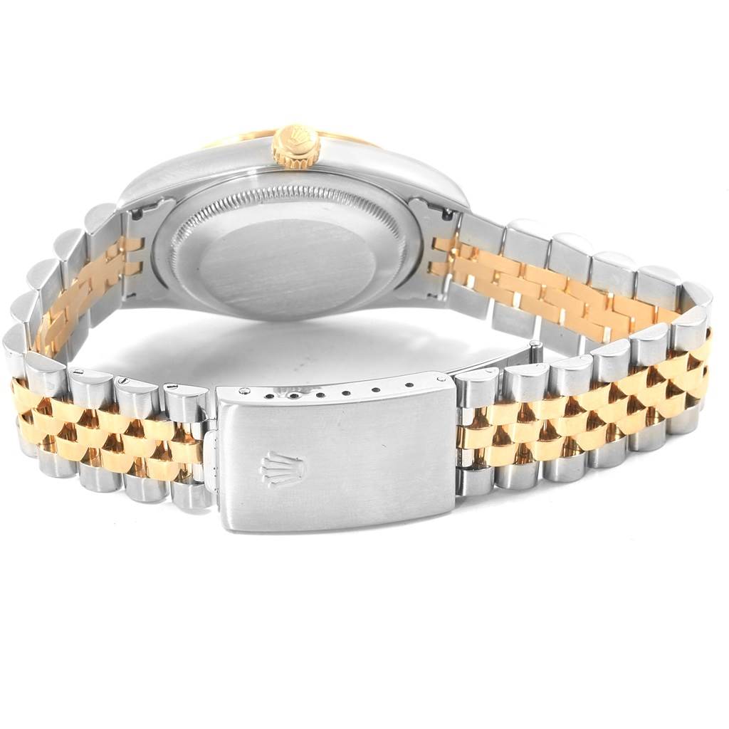 This image shows the back case and two-tone metal bracelet of a Rolex Datejust 16233 Men's Steel and Gold (two tone) Champagne Dial 16233 Men's Steel and Gold (two tone) Champagne Dial watch, including the clasp and crown.