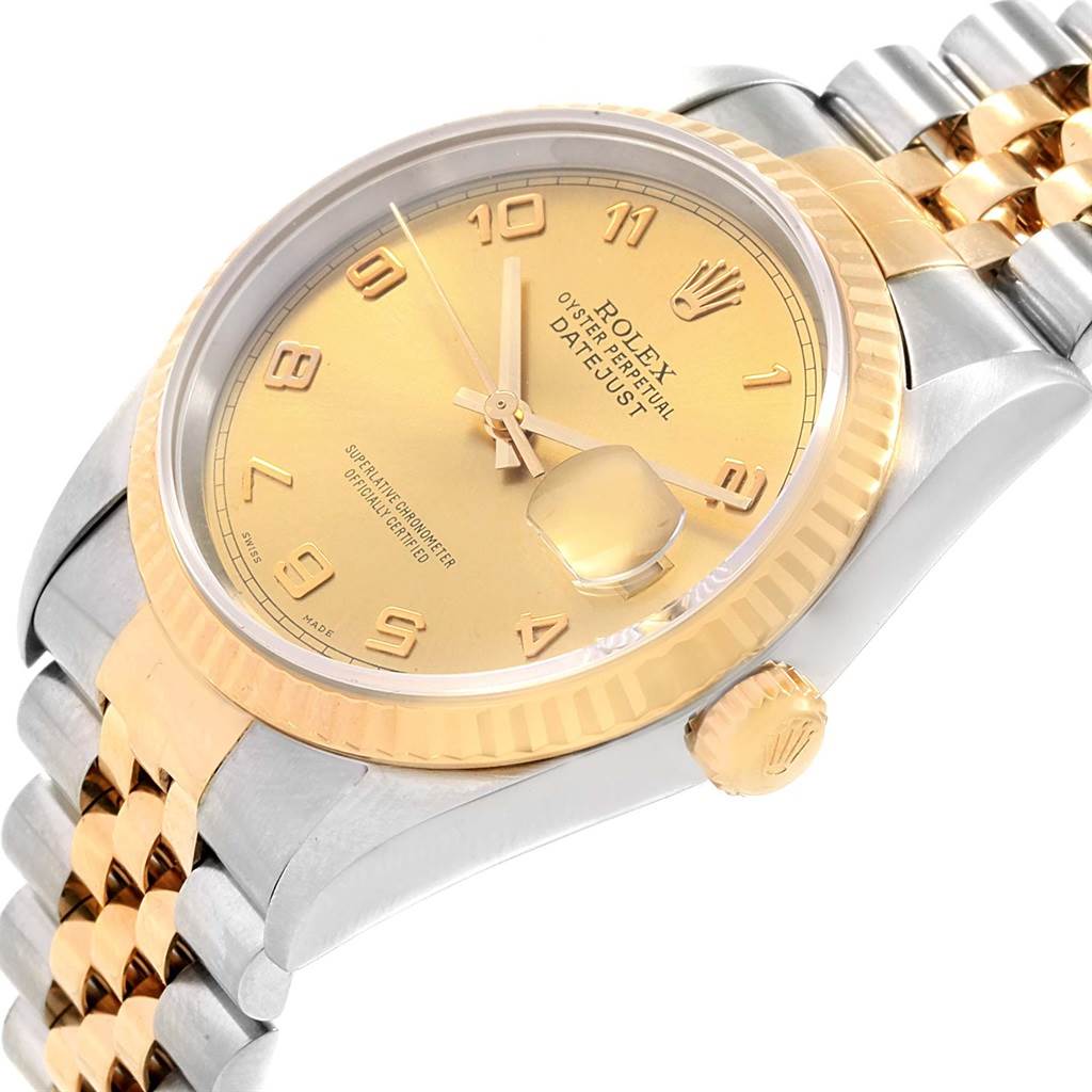 This image shows a close-up, angled view of a Rolex Datejust 16233 Men's Steel and Gold (two tone) Champagne Dial 16233 Men's Steel and Gold (two tone) Champagne Dial watch, highlighting its dial, bezel, crown, and bracelet.