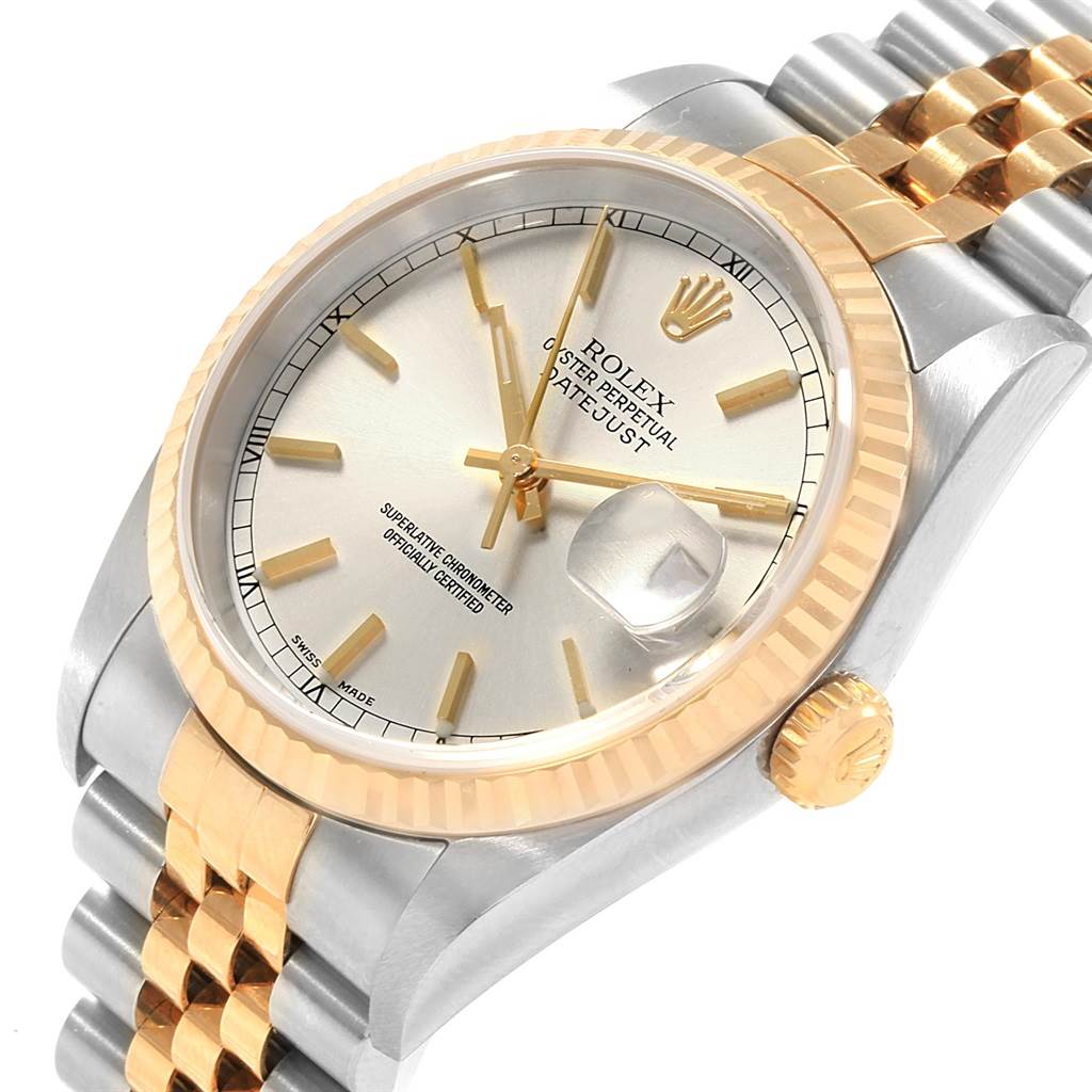 This image shows a Rolex Datejust 16233 Men's Steel and Gold (two tone) Silver Dial 16233 Men's Steel and Gold (two tone) Silver Dial watch at an angled view, highlighting its face, bezel, crown, and part of the jubilee bracelet.